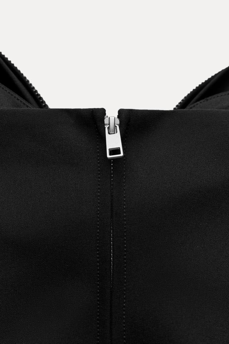 Top de mujer corto con detalle de lazo y acabado brillante-Tops for women-Casaluzia